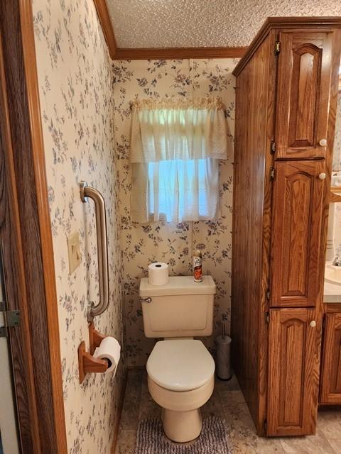 3483 First Fork Rd, Grove Twp, PA 15861 - bathroom with toilet, ornamental molding, tile patterned flooring, wallpapered walls, and vanity