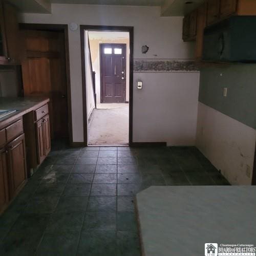 206 W Green St, Olean-City, NY 14760 - kitchen featuring black microwave and light countertops