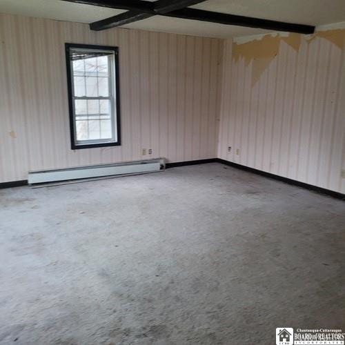 206 W Green St, Olean-City, NY 14760 - spare room featuring a baseboard radiator
