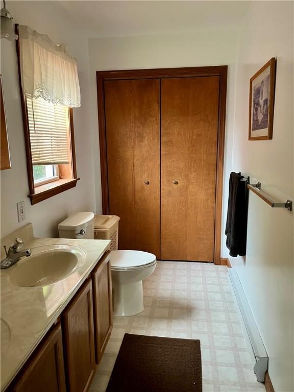 8255 County Highway 2, Andes, NY 13731 - bathroom with tile patterned floors, toilet, and double vanity