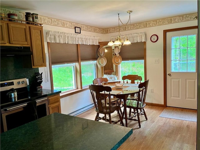 8255 County Highway 2, Andes, NY 13731 - dining area with a chandelier, baseboard heating, healthy amount of natural light, and light wood-style floors