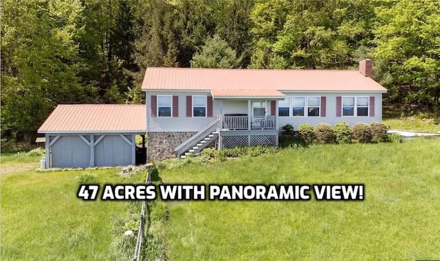 8255 County Highway 2, Andes, NY 13731 - ranch-style house with a front lawn, a chimney, metal roof, a forest view, and covered porch