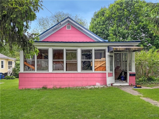 102 Milton Ave, Syracuse, NY 13204 - view of front of property with a sunroom and a front yard