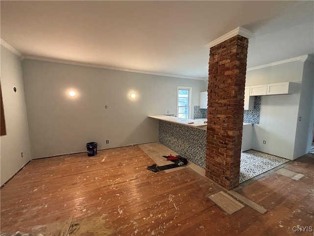 102 Milton Ave, Syracuse, NY 13204 - laundry area with ornate columns, wood-type flooring, and crown molding