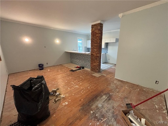 102 Milton Ave, Syracuse, NY 13204 - spare room with ornamental molding, decorative columns, and wood finished floors
