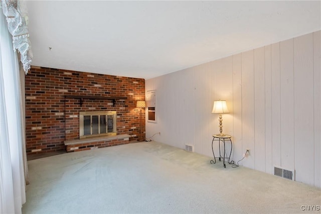 112 Vanida Dr, Camillus, NY 13031 - unfurnished living room with carpet and a brick fireplace