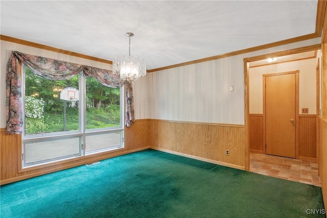 112 Vanida Dr, Camillus, NY 13031 - spare room featuring a chandelier, wood walls, wainscoting, crown molding, and carpet
