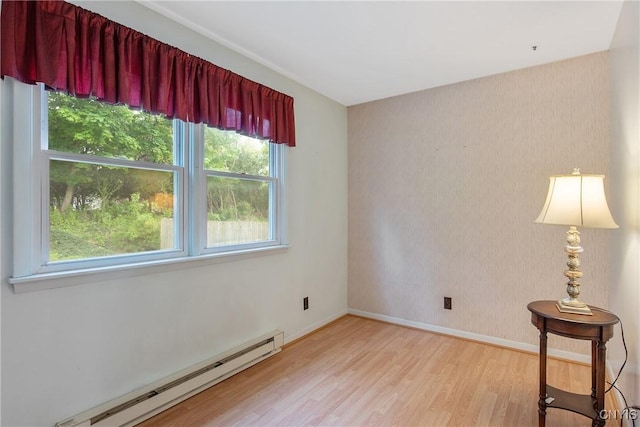 112 Vanida Dr, Camillus, NY 13031 - unfurnished room with a baseboard radiator, healthy amount of natural light, light wood-style floors, and baseboards
