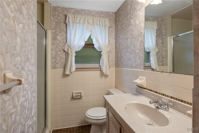 112 Vanida Dr, Camillus, NY 13031 - bathroom with tile walls, toilet, a stall shower, vanity, and wallpapered walls