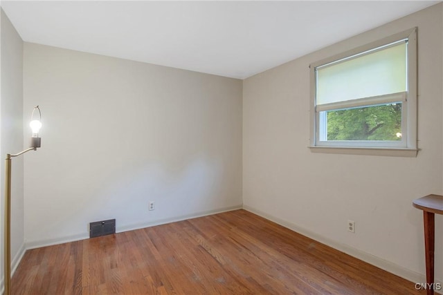 112 Vanida Dr, Camillus, NY 13031 - empty room featuring wood finished floors and baseboards