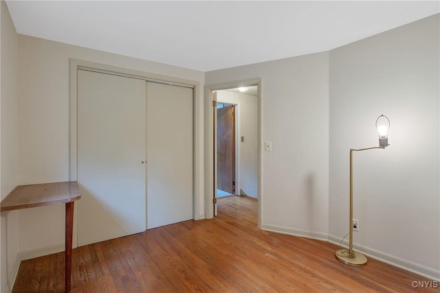 112 Vanida Dr, Camillus, NY 13031 - unfurnished bedroom featuring light wood finished floors, a closet, and baseboards