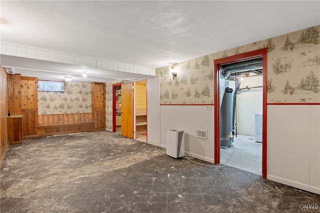 112 Vanida Dr, Camillus, NY 13031 - below grade area with wallpapered walls, a wainscoted wall, water heater, washer / dryer, and baseboards
