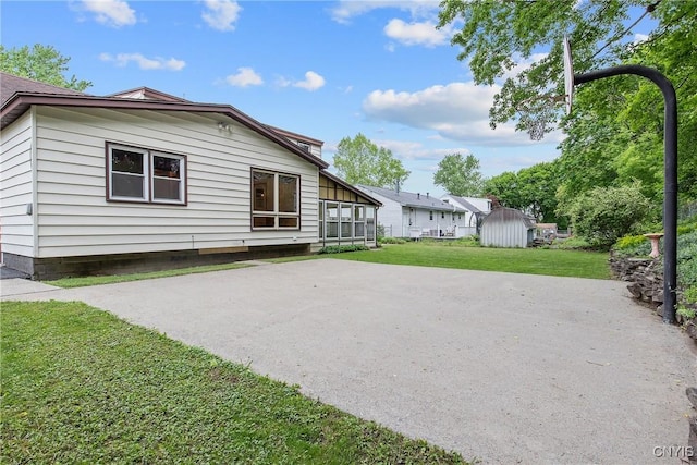 112 Vanida Dr, Camillus, NY 13031 - rear view of house with a lawn and a patio area