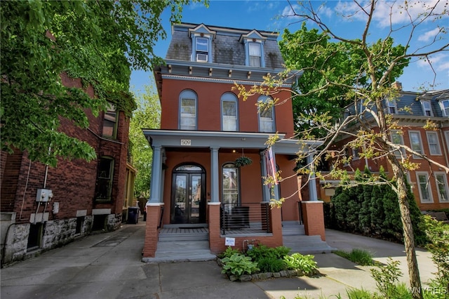 509 Virginia St, Buffalo, NY 14202 - victorian home with a high end roof, mansard roof, and a porch