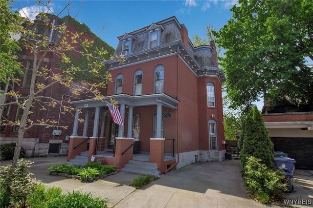 509 Virginia St, Buffalo, NY 14202 - second empire-style home featuring a porch and mansard roof