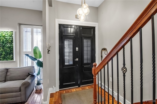 509 Virginia St, Buffalo, NY 14202 - foyer entrance featuring stairway, baseboards, and wood finished floors