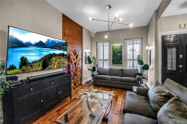 509 Virginia St, Buffalo, NY 14202 - living room featuring a chandelier, wood finished floors, and baseboards