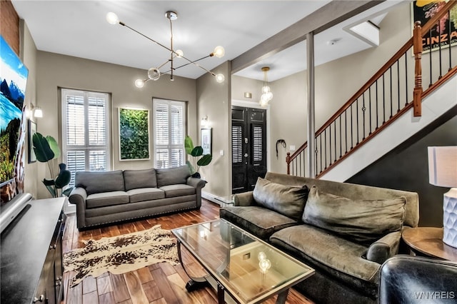 509 Virginia St, Buffalo, NY 14202 - living room with a chandelier, wood finished floors, and stairs
