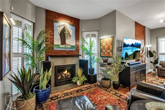 509 Virginia St, Buffalo, NY 14202 - living area featuring a brick fireplace and wood finished floors