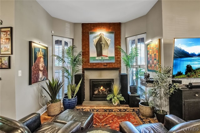 509 Virginia St, Buffalo, NY 14202 - living room featuring a brick fireplace and wood finished floors
