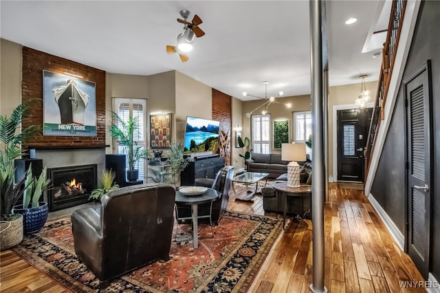 509 Virginia St, Buffalo, NY 14202 - living room with hardwood / wood-style flooring, a large fireplace, and baseboards