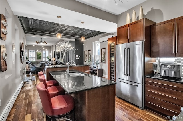 509 Virginia St, Buffalo, NY 14202 - kitchen featuring high quality fridge, a sink, a kitchen island with sink, dark wood finished floors, and open floor plan