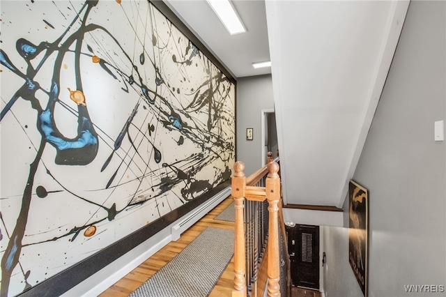 509 Virginia St, Buffalo, NY 14202 - stairway with wood finished floors, a baseboard radiator, and baseboards