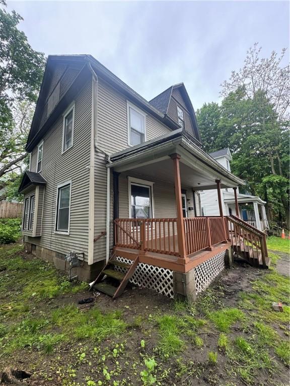 213 Flint St, Rochester, NY 14608 - view of side of property featuring a porch