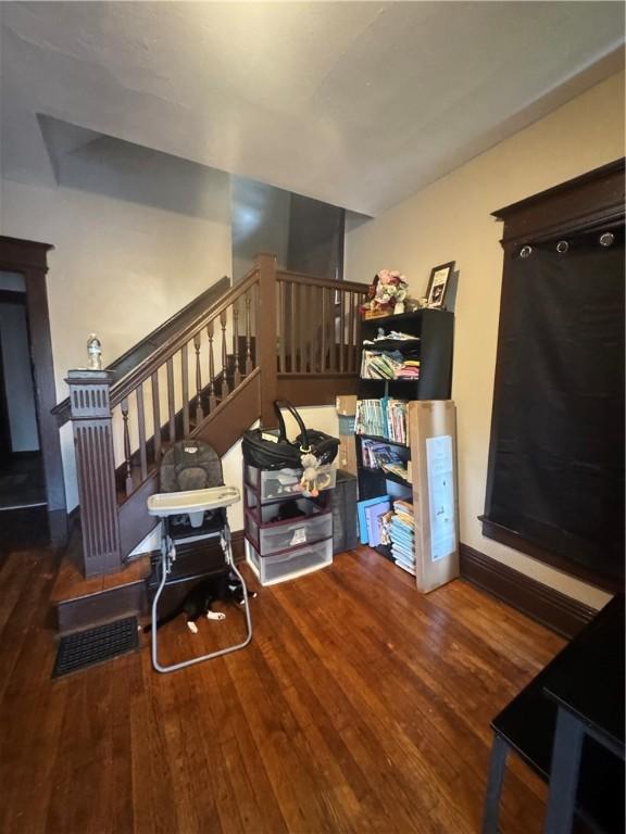 213 Flint St, Rochester, NY 14608 - stairs featuring wood finished floors
