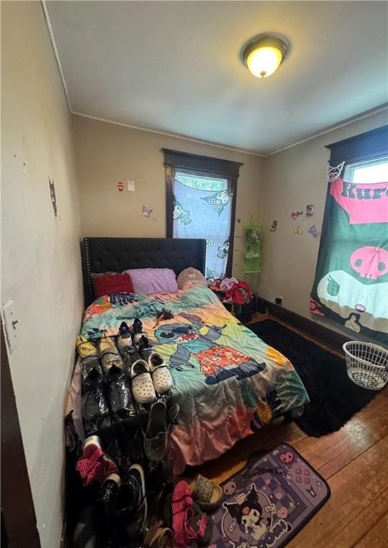 213 Flint St, Rochester, NY 14608 - bedroom with hardwood / wood-style floors, multiple windows, and crown molding