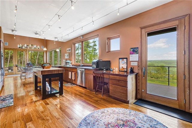 8763 Greyton H Taylor Memorial Dr, Urbana, NY 14840 - office space featuring rail lighting, light wood-style flooring, and a sink