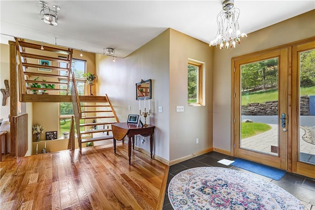 8763 Greyton H Taylor Memorial Dr, Urbana, NY 14840 - entryway featuring french doors, baseboards, a chandelier, and stairway