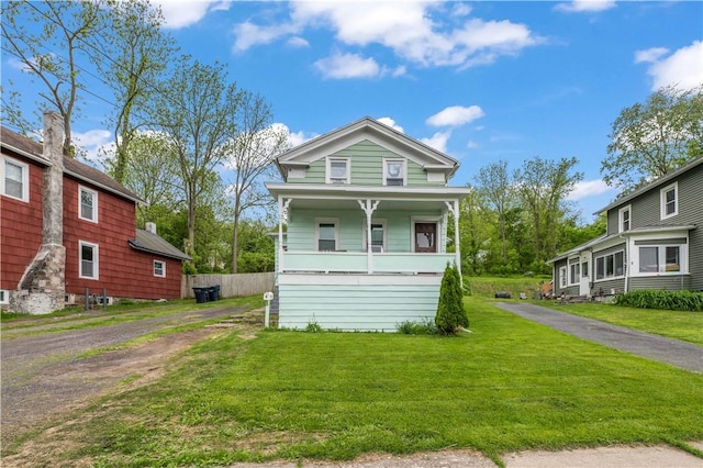 3 Maple St, Lyons, NY 14489 - view of front of home featuring a front yard and covered porch