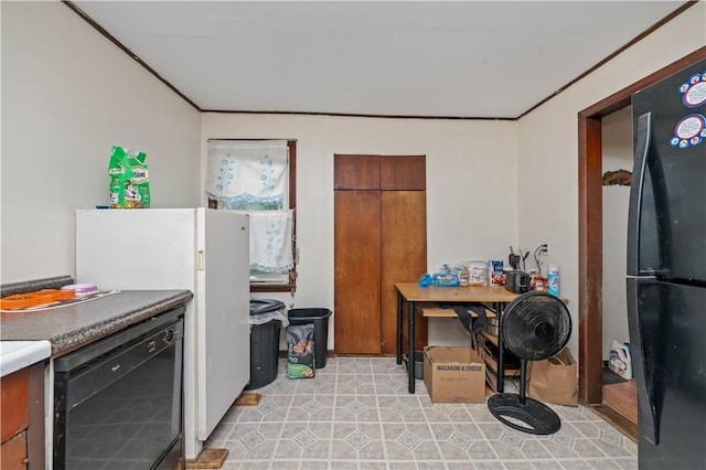 3 Maple St, Lyons, NY 14489 - kitchen with black appliances, ornamental molding, and brown cabinets