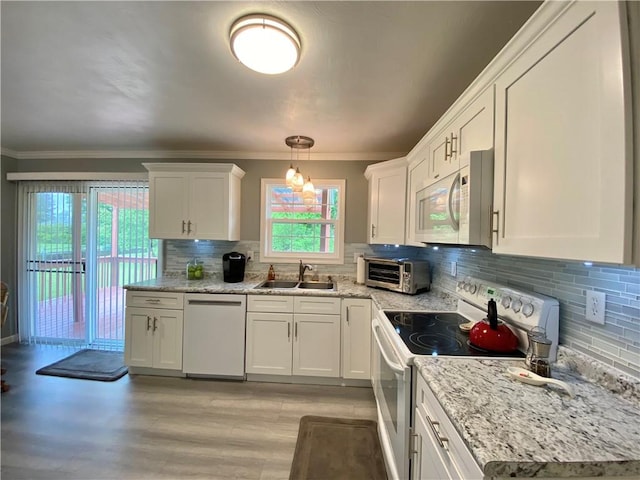 5 Melvins Ln, Big Flats, NY 14845 - kitchen with white appliances, a sink, ornamental molding, white cabinets, and tasteful backsplash