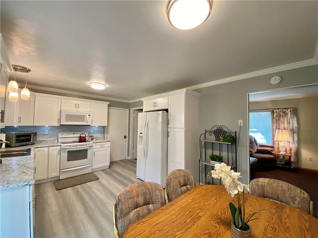 5 Melvins Ln, Big Flats, NY 14845 - kitchen with white appliances, light wood finished floors, ornamental molding, white cabinetry, and decorative backsplash