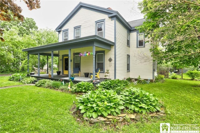 25 Academy St, Westfield, NY 14787 - view of front of house with covered porch and a front lawn