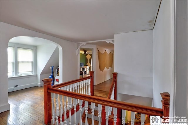 25 Academy St, Westfield, NY 14787 - corridor featuring an upstairs landing, wood-type flooring, arched walkways, and baseboards