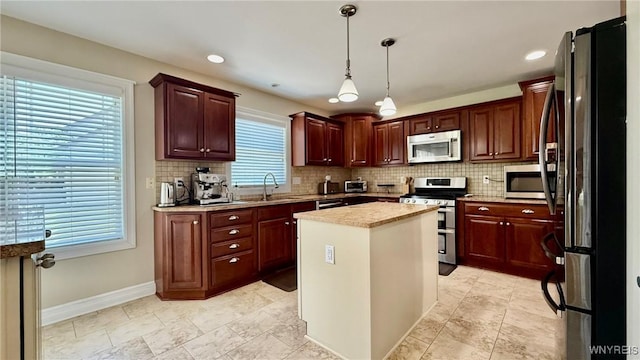 65 Islewoods, Grand Island, NY 14072 - kitchen with appliances with stainless steel finishes, a sink, backsplash, baseboards, and recessed lighting