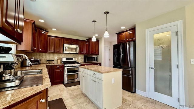 65 Islewoods, Grand Island, NY 14072 - kitchen with stainless steel appliances, tasteful backsplash, pendant lighting, recessed lighting, and a kitchen island