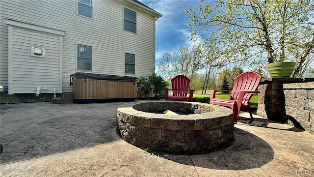 65 Islewoods, Grand Island, NY 14072 - view of patio with a hot tub and an outdoor fire pit