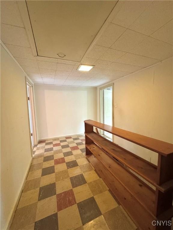 411 Hamilton St, Rome-Inside, NY 13440 - hallway with light floors, a drop ceiling, stairs, and baseboards