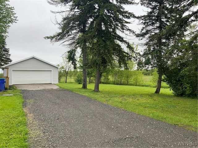 1750 Yates Carlton Townline Rd, Yates, NY 14098 - view of front facade featuring a detached garage, an outbuilding, and a front yard