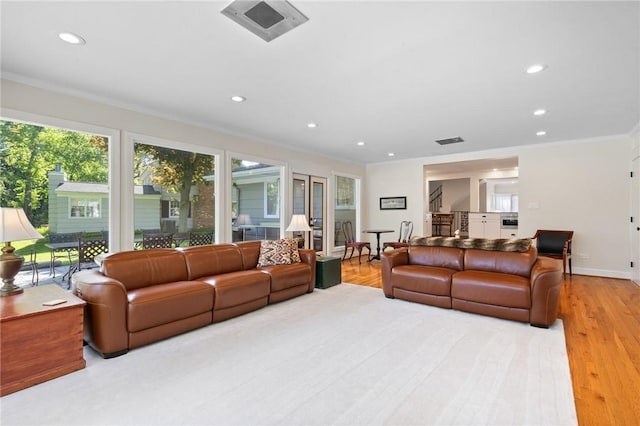 1 Creekside Ln, Pittsford, NY 14618 - living room featuring ornamental molding, plenty of natural light, recessed lighting, wood finished floors, and baseboards