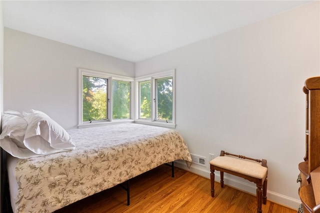 1 Creekside Ln, Pittsford, NY 14618 - bedroom with baseboards and light wood-style flooring