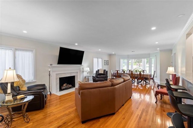 1 Creekside Ln, Pittsford, NY 14618 - living area featuring ornamental molding, a high end fireplace, light wood-style flooring, recessed lighting, and baseboards
