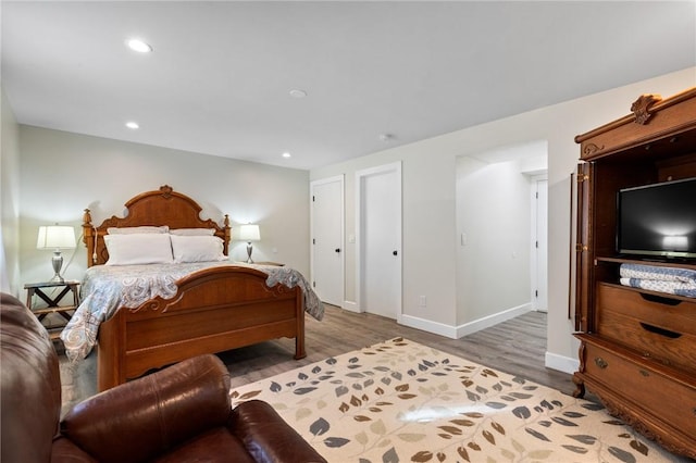1 Creekside Ln, Pittsford, NY 14618 - bedroom featuring wood finished floors, baseboards, and recessed lighting