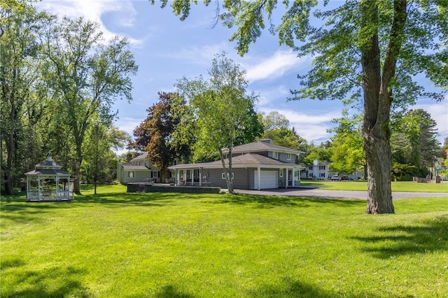 1 Creekside Ln, Pittsford, NY 14618 - view of grassy yard with a gazebo and asphalt driveway
