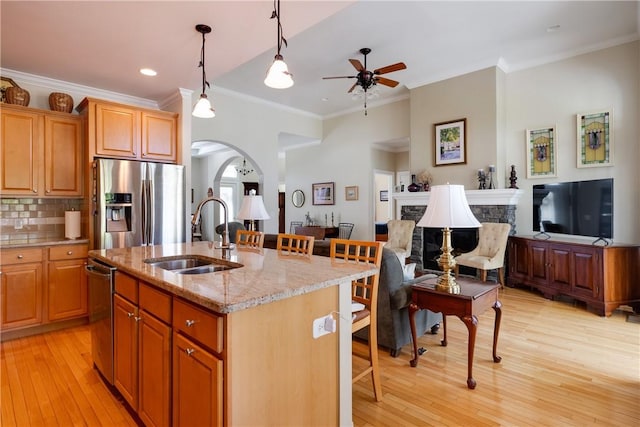 31 Hunters Run, Horseheads, NY 14845 - kitchen featuring a sink, stainless steel appliances, a ceiling fan, ornamental molding, and light wood-type flooring