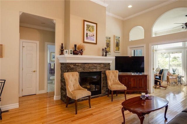 31 Hunters Run, Horseheads, NY 14845 - living area with a ceiling fan, light wood finished floors, ornamental molding, a stone fireplace, and recessed lighting